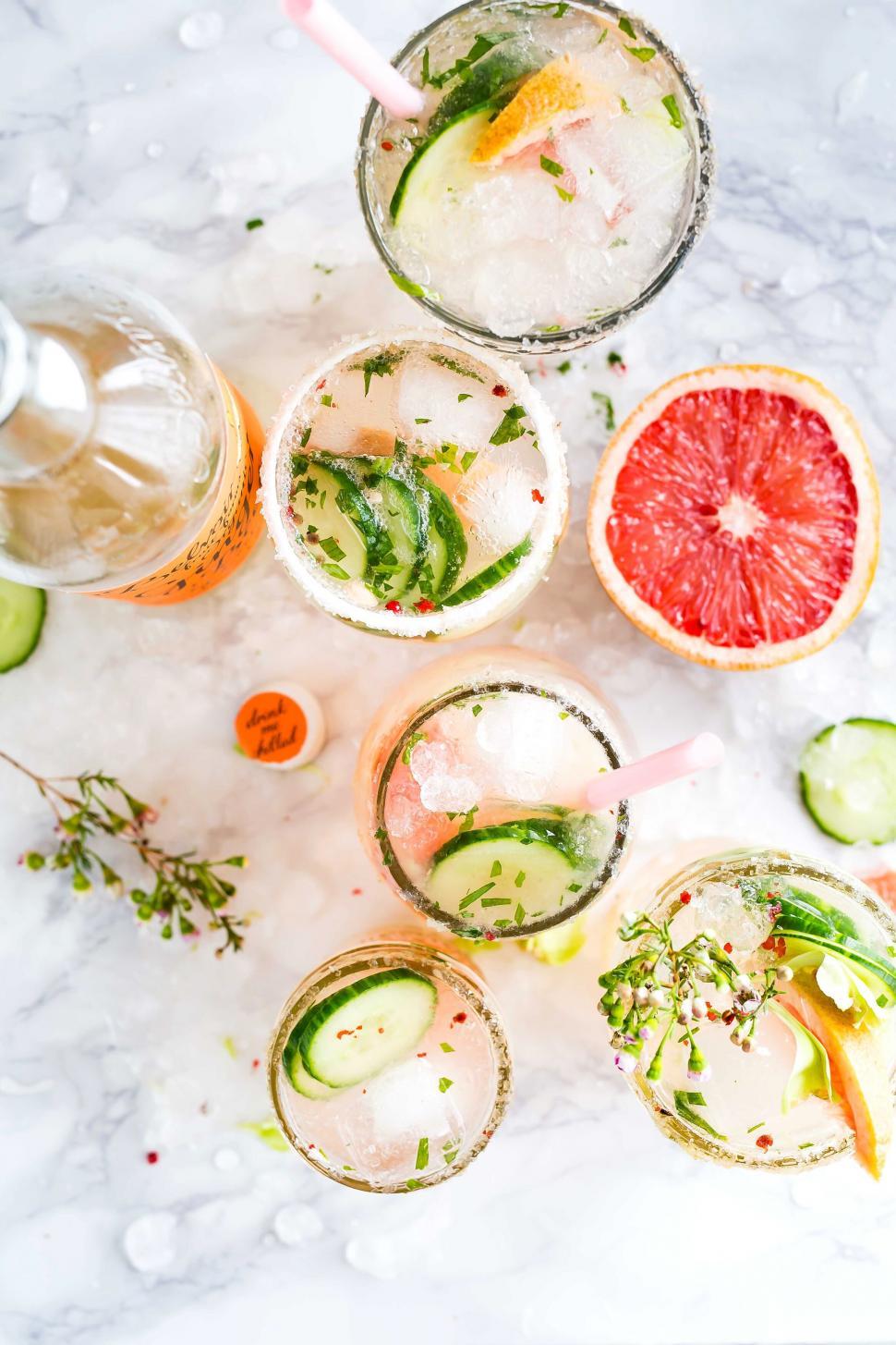 Free Image of Variety of refreshing drinks with fruit garnishes 