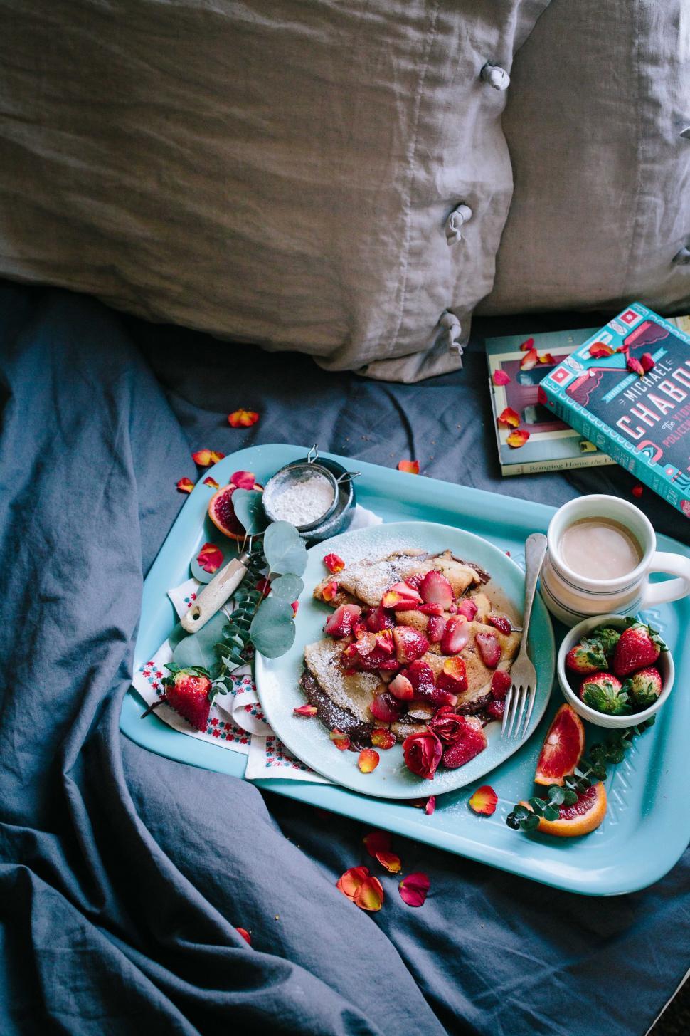 Free Image of Breakfast in bed with a book and fresh fruits 