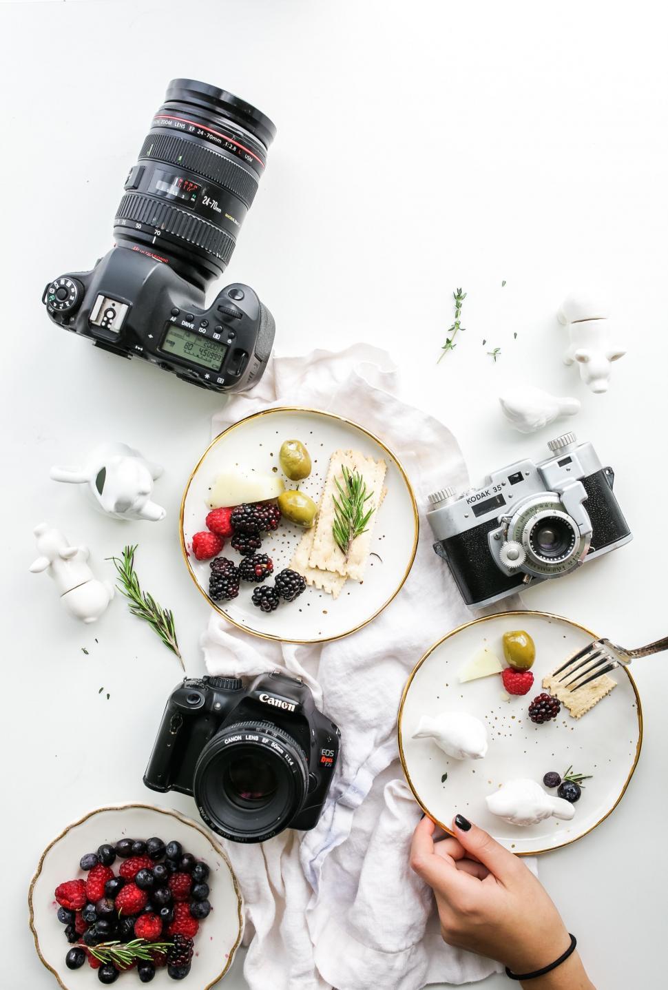 Free Image of Top view of food photography setup with cameras 
