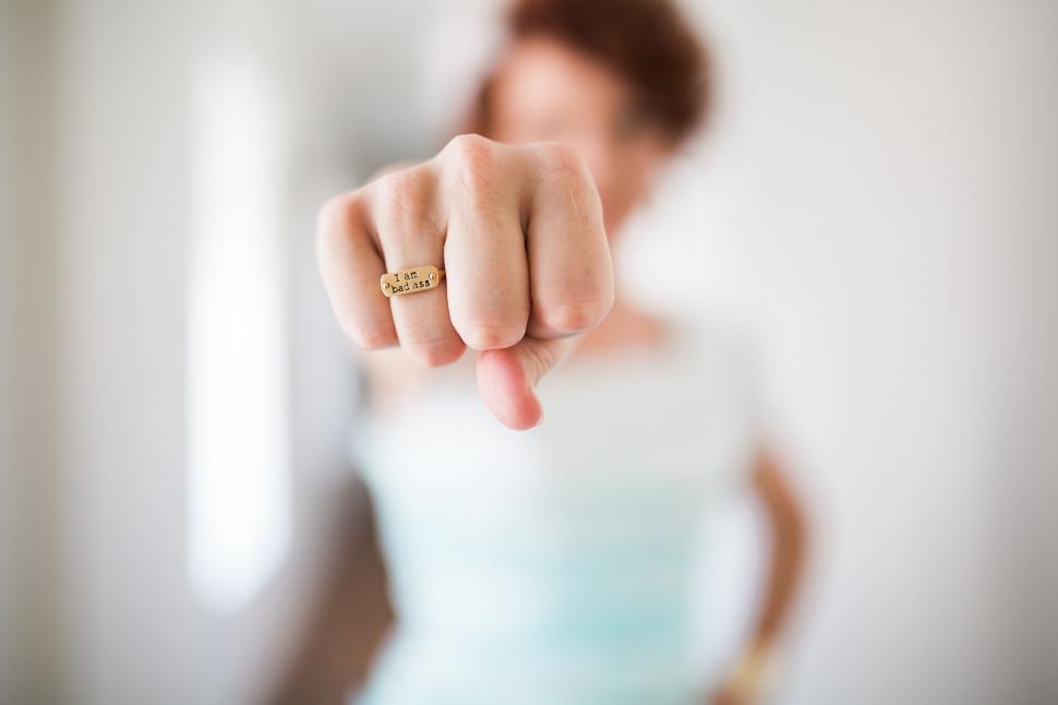 Free Image of Woman pointing towards the camera with focus 