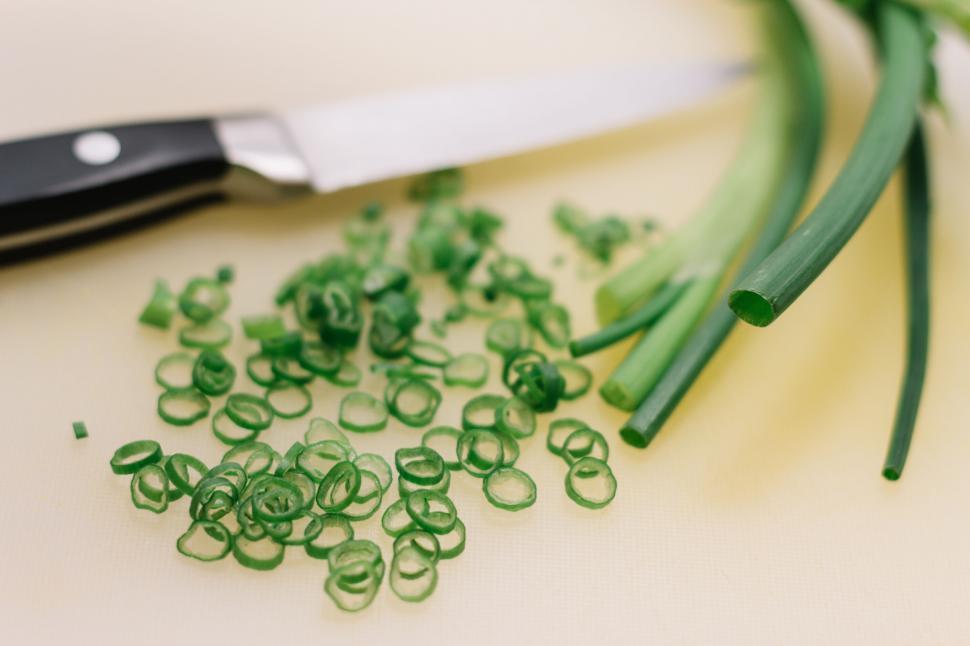 Free Image of Sliced green onions with a sharp knife 