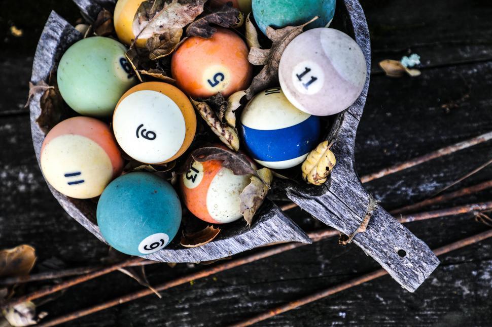 Free Image of Vintage pool balls in a rustic wooden bucket 
