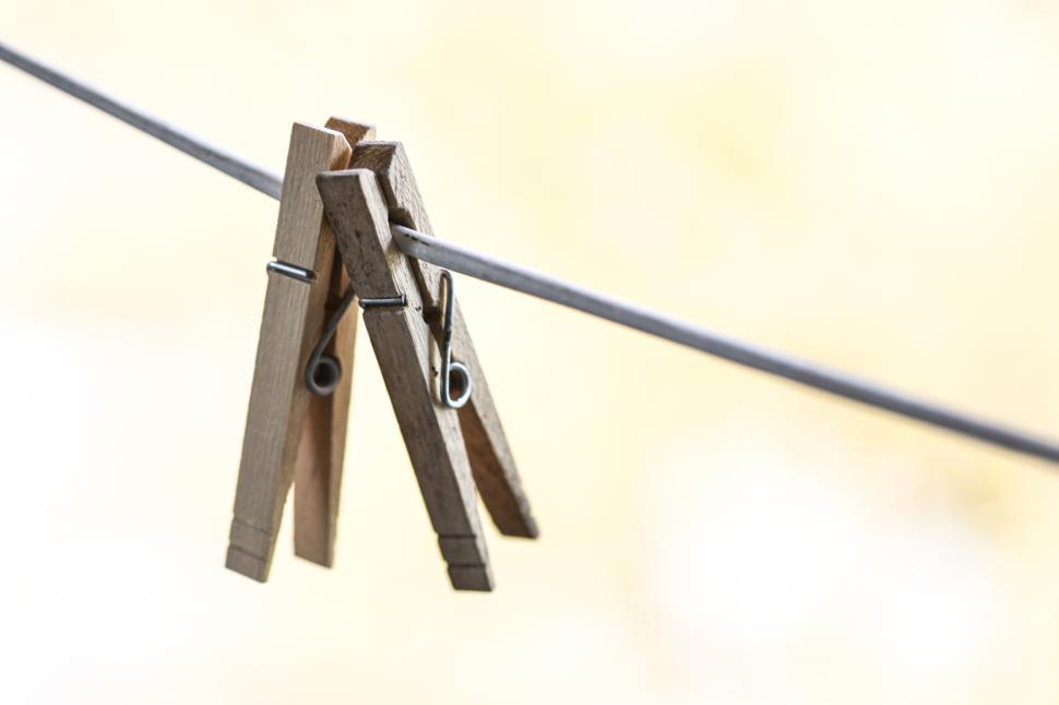 Free Image of Clothespins hanging on a laundry line 