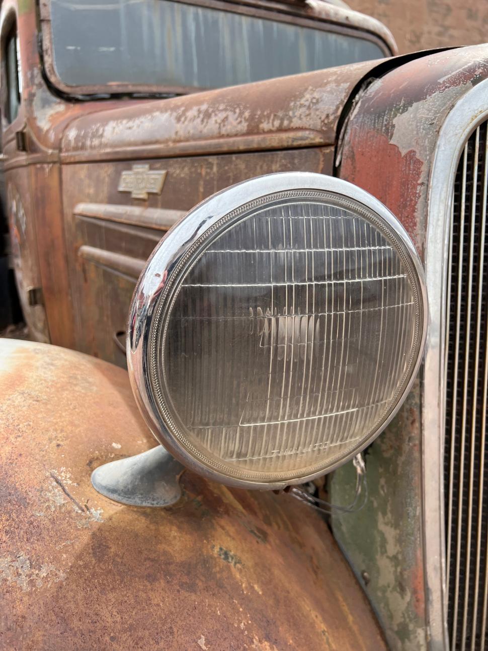 Free Image of Vintage Chevy truck showcasing its headlight 