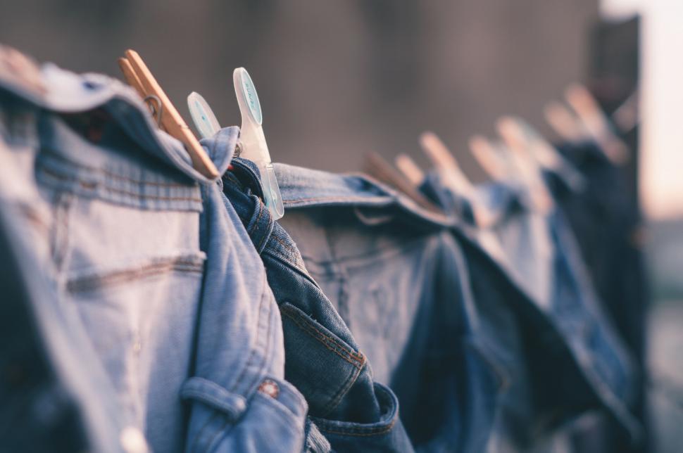 Free Image of Rows of jeans hanging to dry outdoors 
