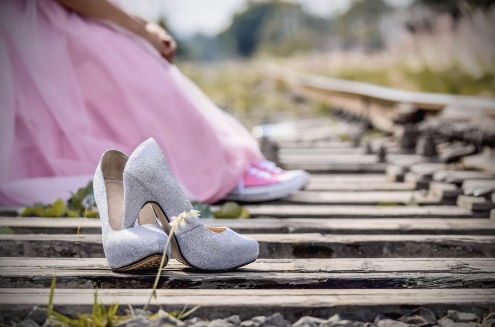 Free Image of Elegant high heels on a railway track 
