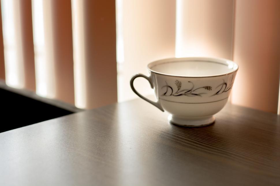 Free Image of Tea cup basking in natural light on table 