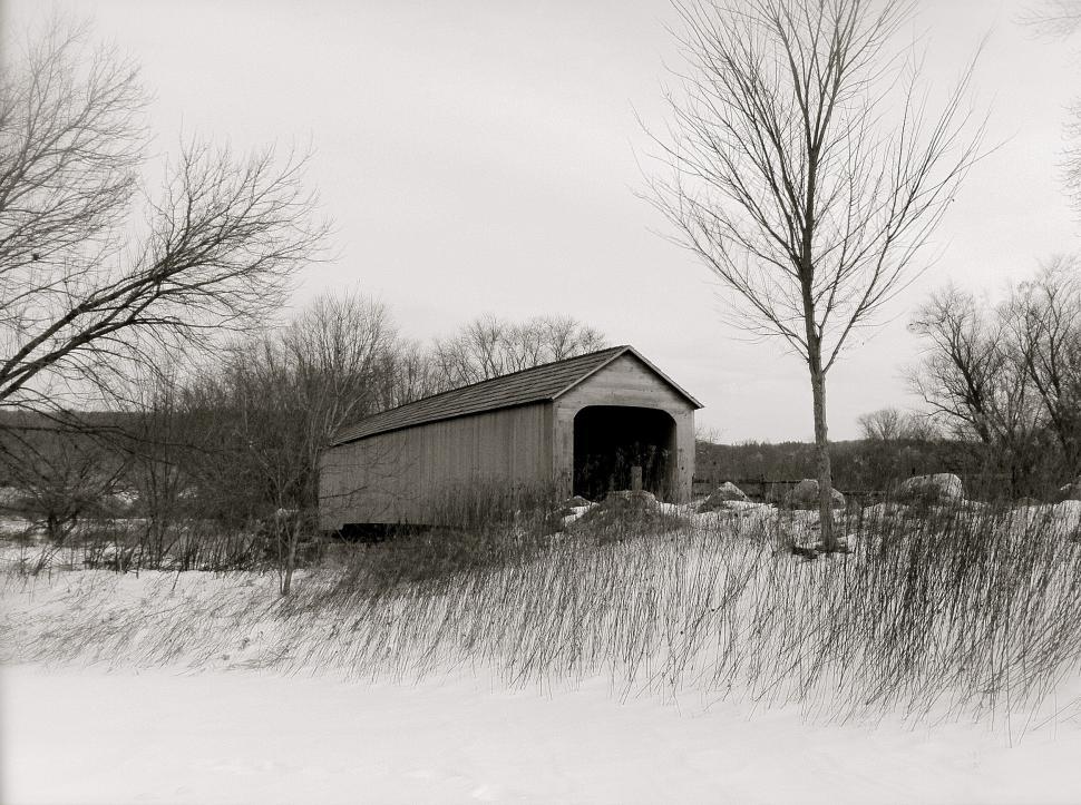 Free Image of Historic covered bridge in a winter setting 