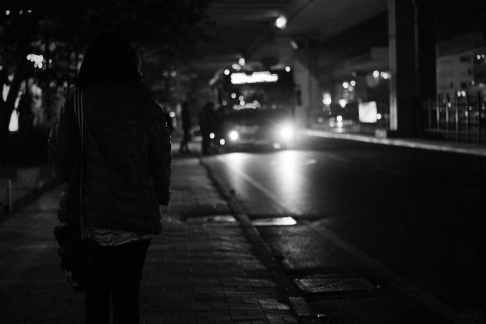 Free Image of Silhouette of a person waiting at night 