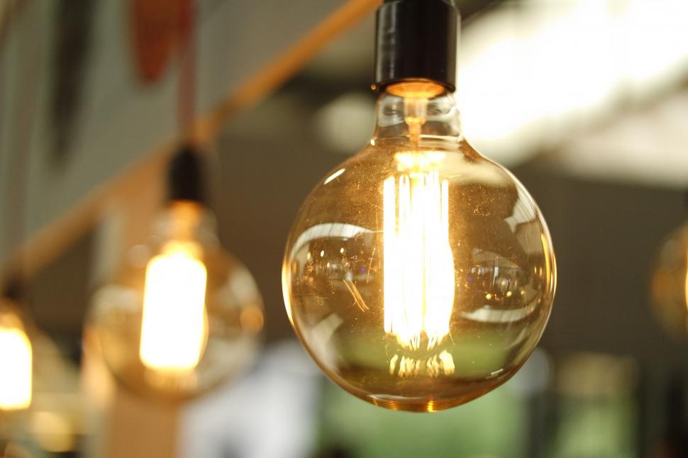 Free Image of Close-up of glowing filament in glass bulb 