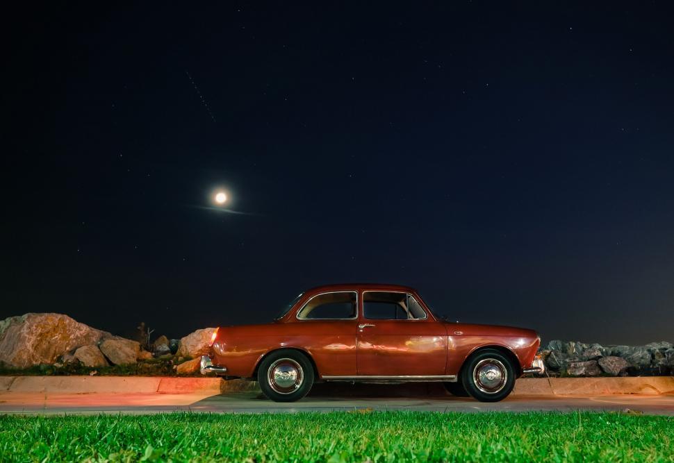 Free Image of Vintage car under starry night sky 
