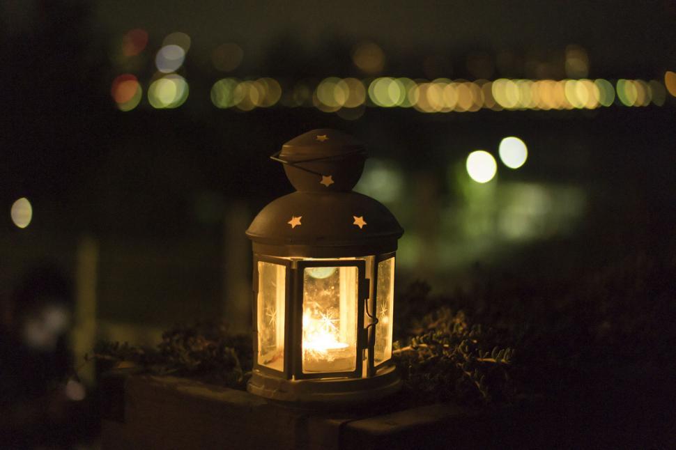 Free Image of Glowing lantern in a dark evening setting 