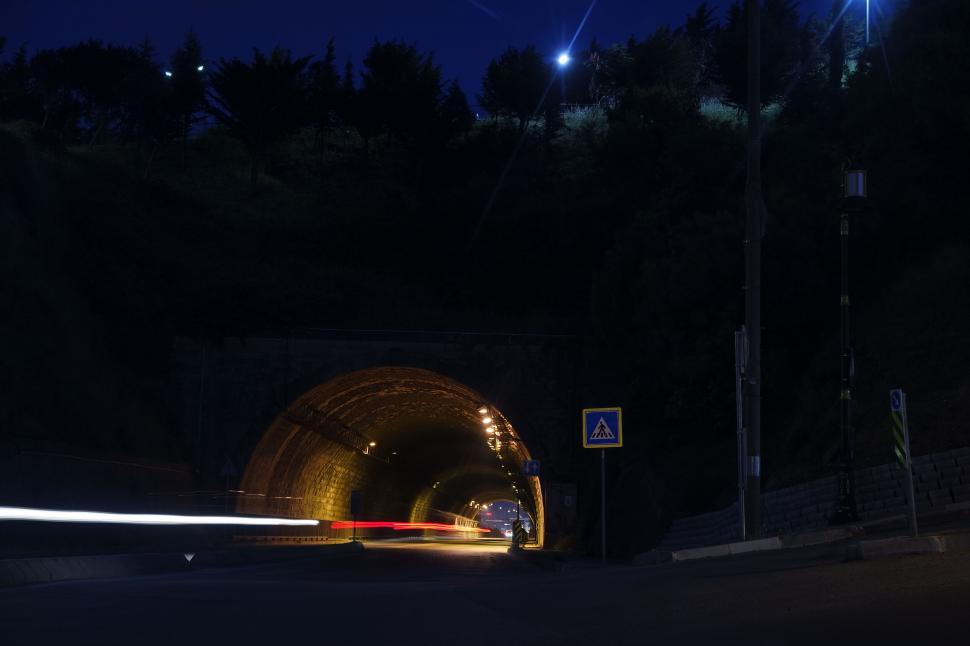 Free Image of Night shot of a tunnel with light trails 