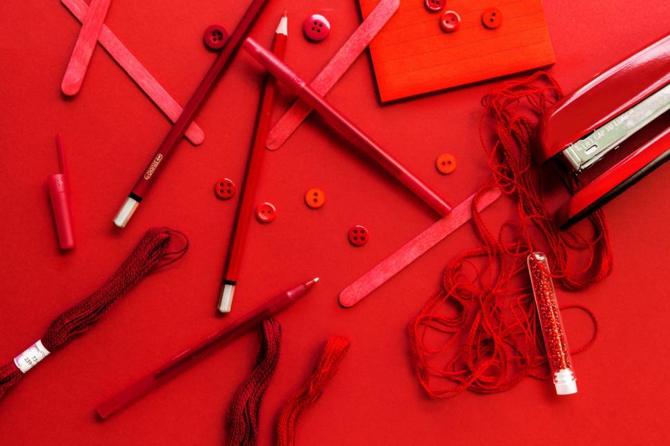 Free Image of Red themed creative flat lay composition 