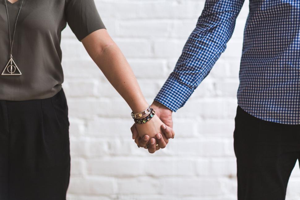 Free Image of Close-up of couple holding hands together 