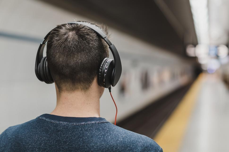 Free Image of Man with headphones at subway station 