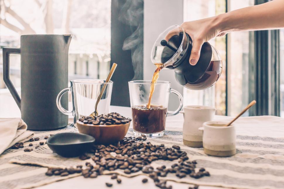 Free Image of Pouring coffee in a cozy home setting 