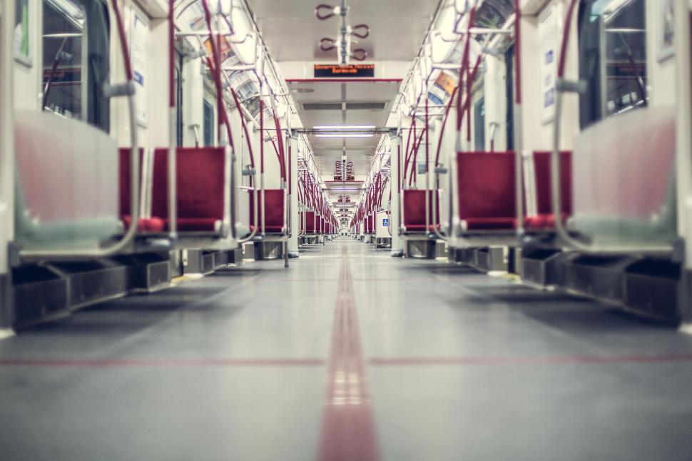 Free Image of Empty subway train interior with red seats 