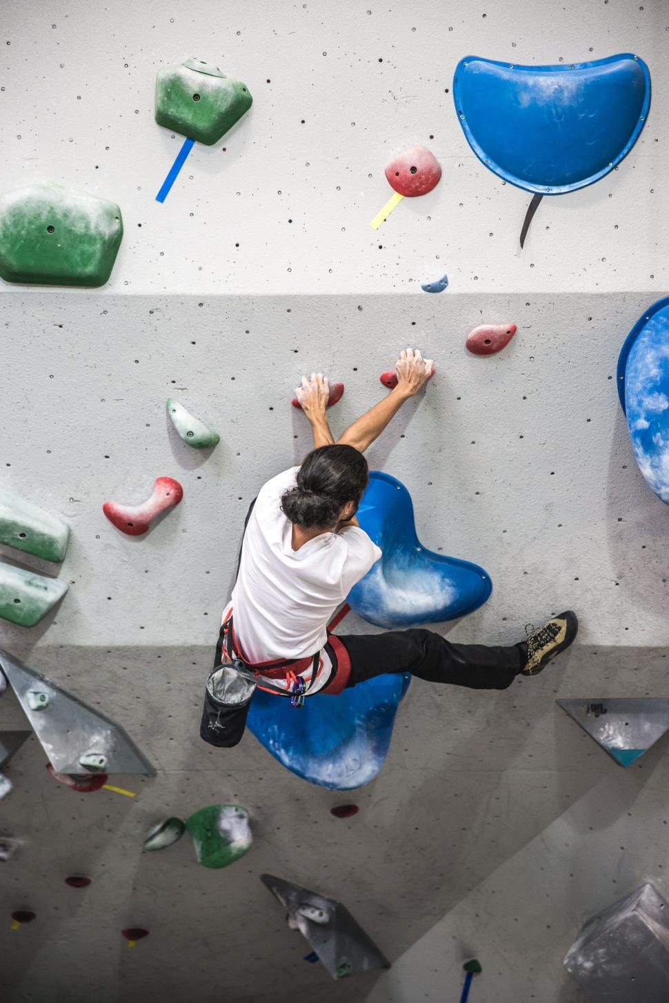 Free Image of Climber ascending indoor climbing wall 