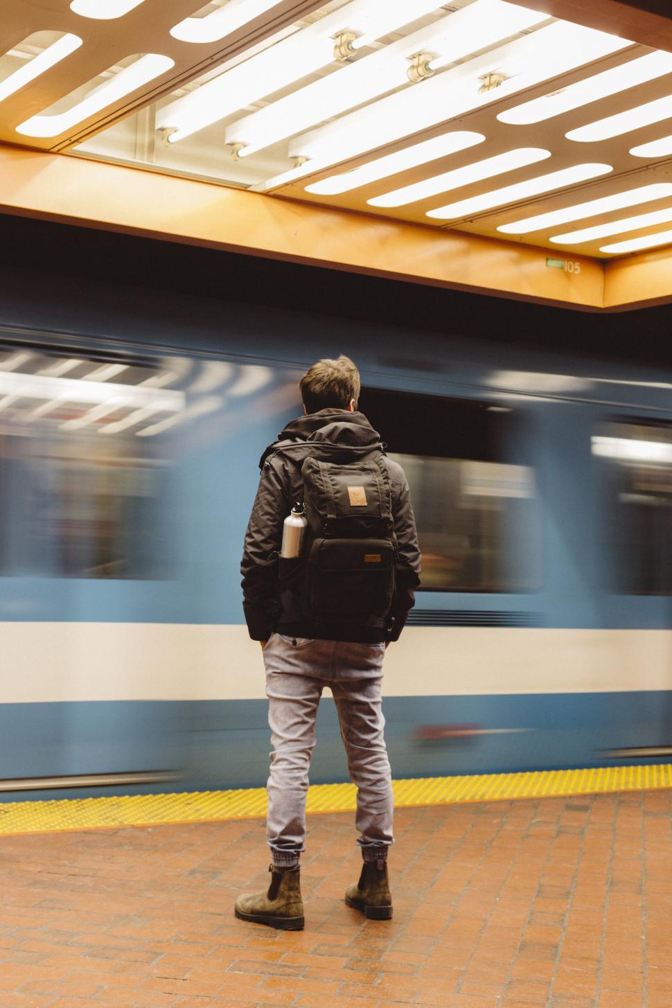 Free Image of Man waiting for train at subway station 