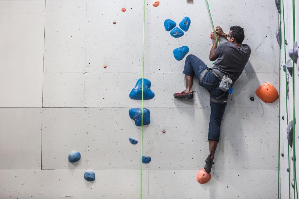 Free Image of Man climbing indoor rock wall 