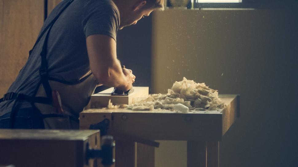Free Image of Carpenter working in a woodshop 