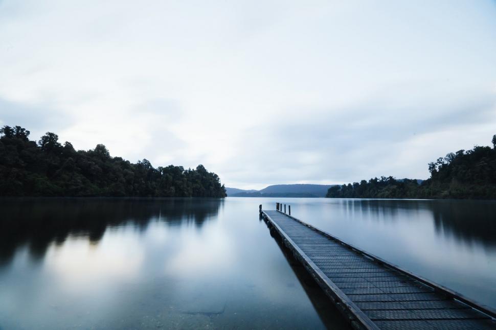 Free Image of Tranquil lakeside jetty at dusk 