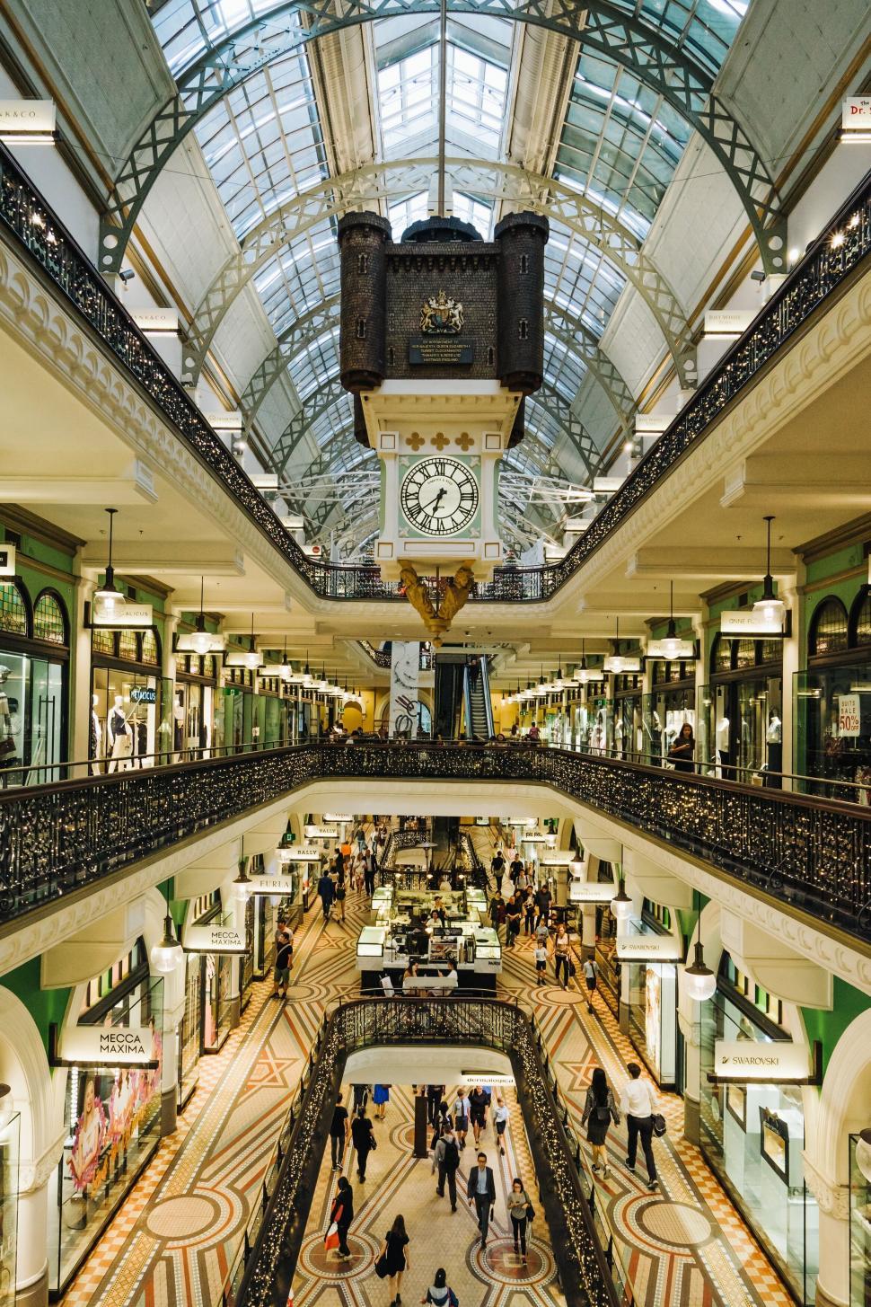 Free Image of Elegant shopping arcade with grand clock 