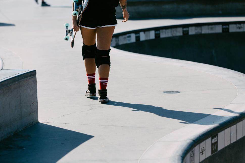 Free Image of Skateboarder s legs at skatepark 