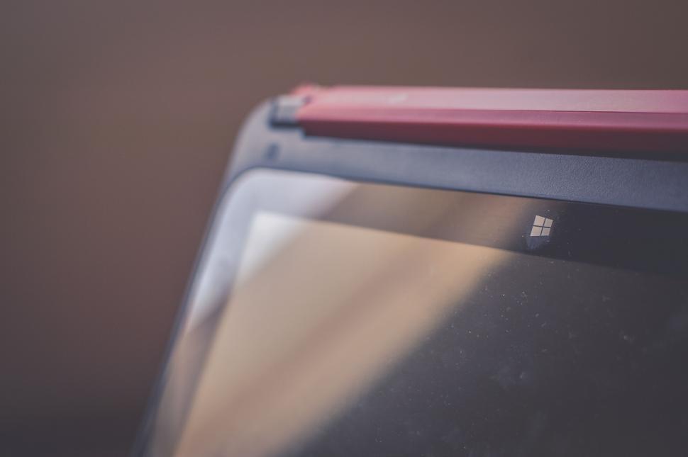 Free Image of Laptop with Red Detail and Windows Logo 