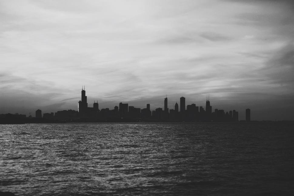 Free Image of Monochrome skyline silhouette by the lake 