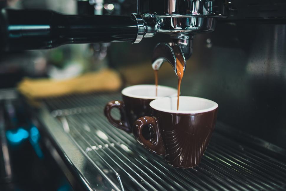 Free Image of Double espresso shot pouring into cups 