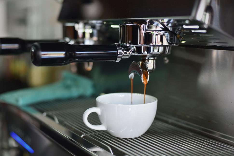 Free Image of Espresso coffee dripping from machine 