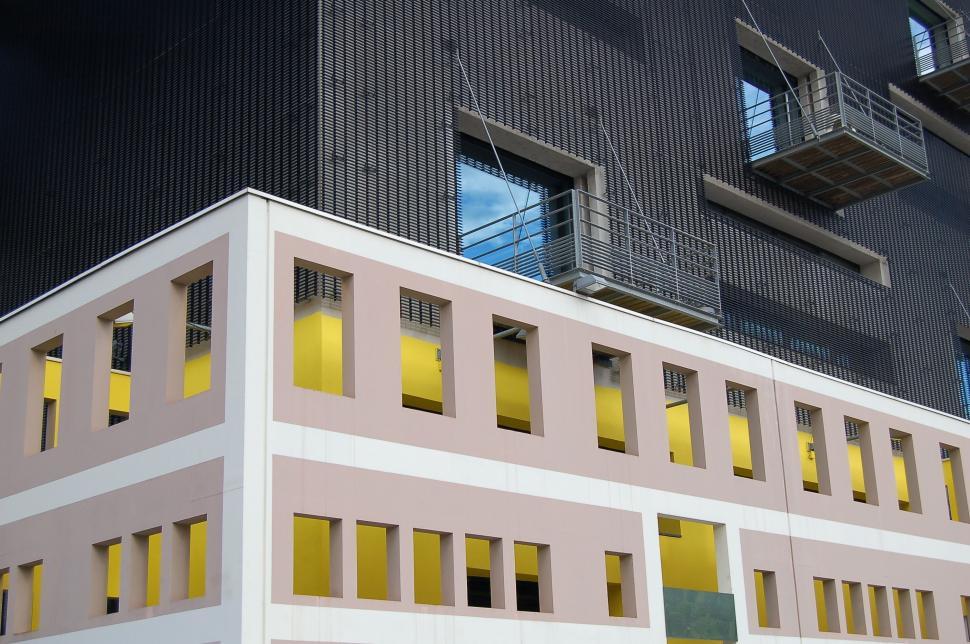 Free Image of Modern building with yellow accents and glass 