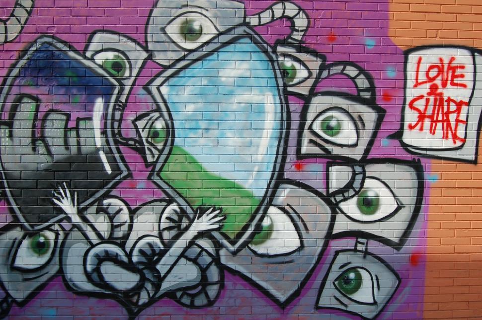 Free Image of Colorful urban graffiti art on brick wall 