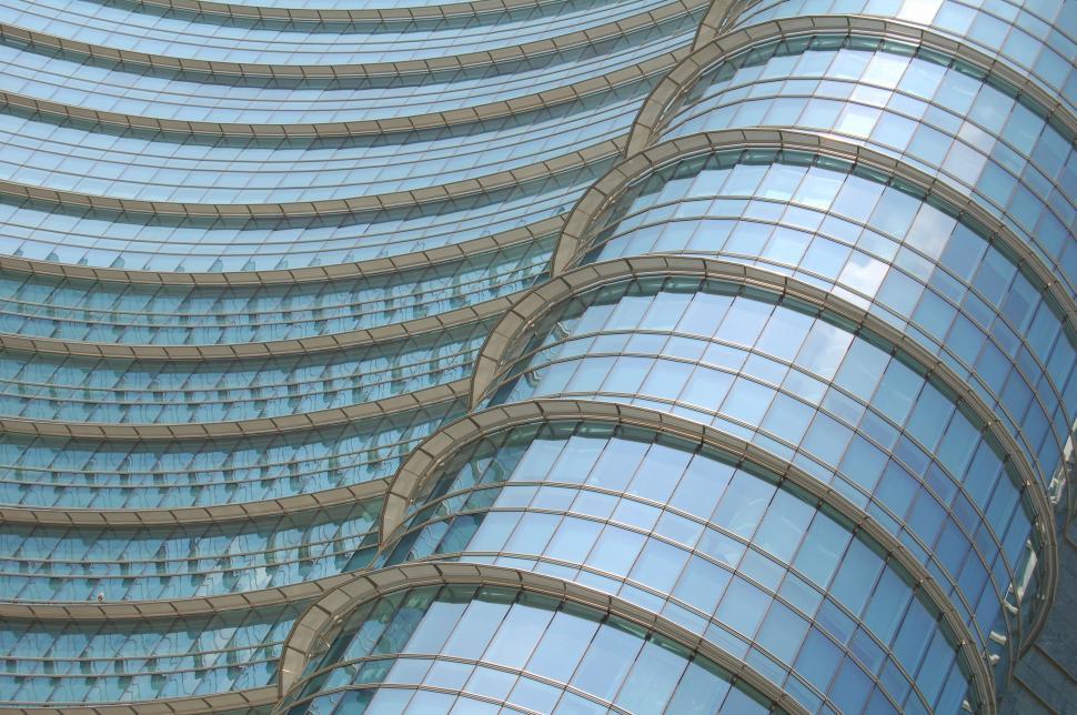 Free Image of Modern curving glass facade of a skyscraper 