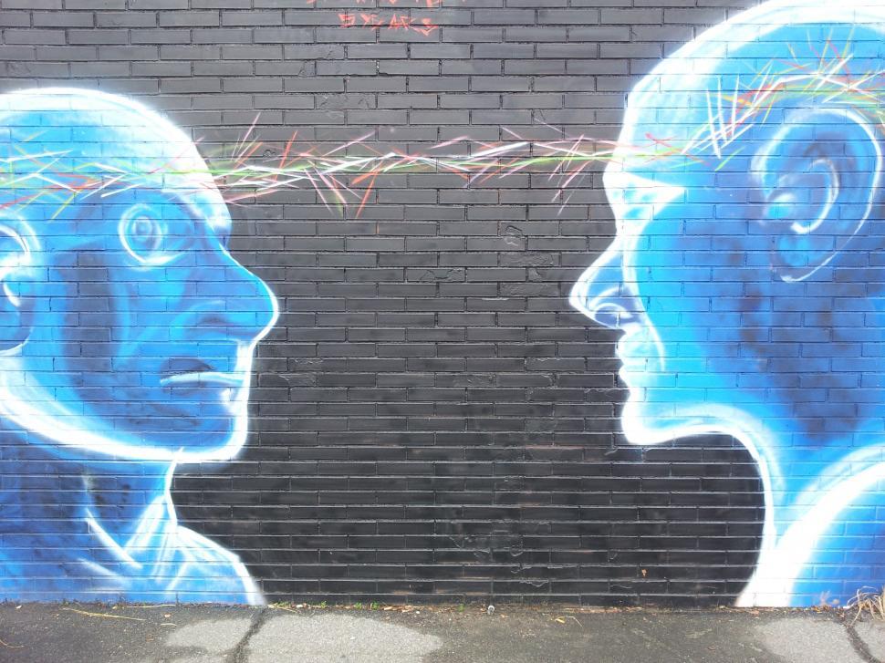 Free Image of Faces mural with colorful brain waves 
