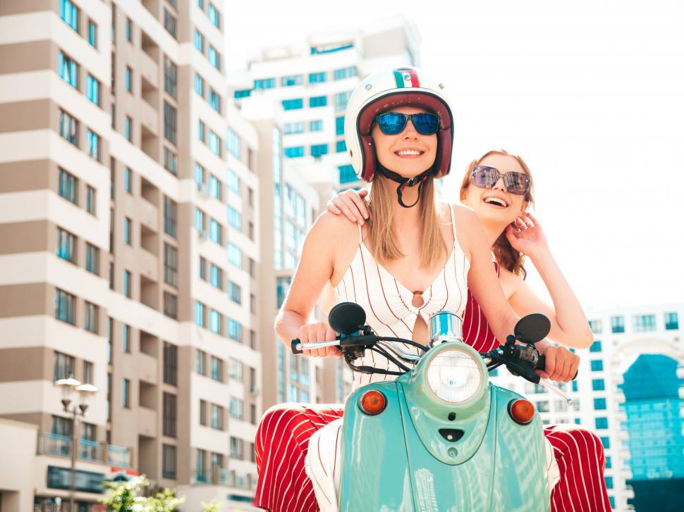 Free Image of Two women on a scooter 