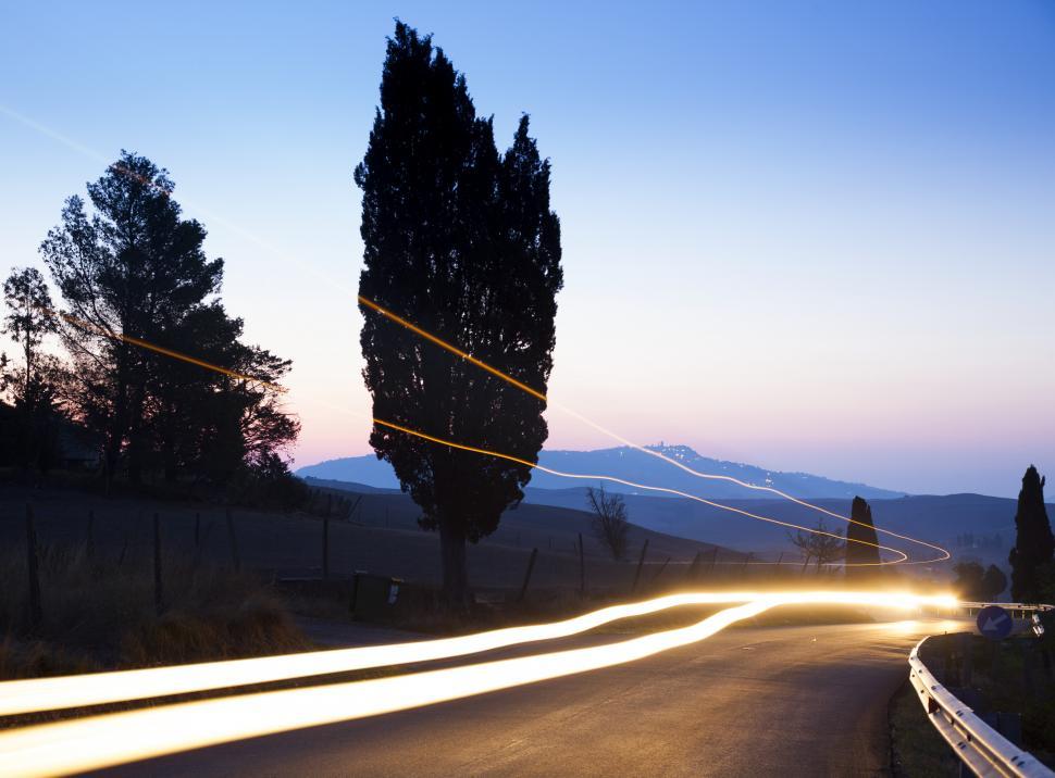 Free Image of A road with light streaks on it 