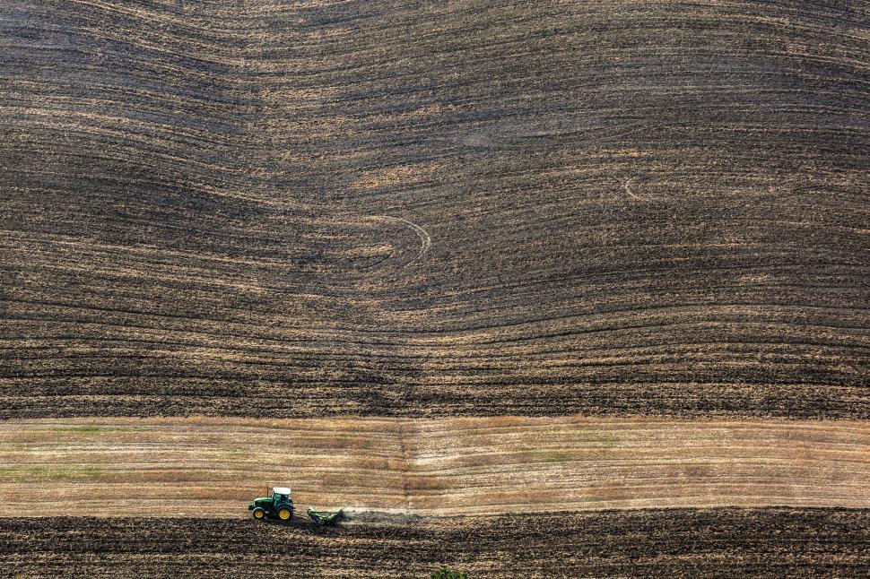 Free Image of A tractor plowing a field 