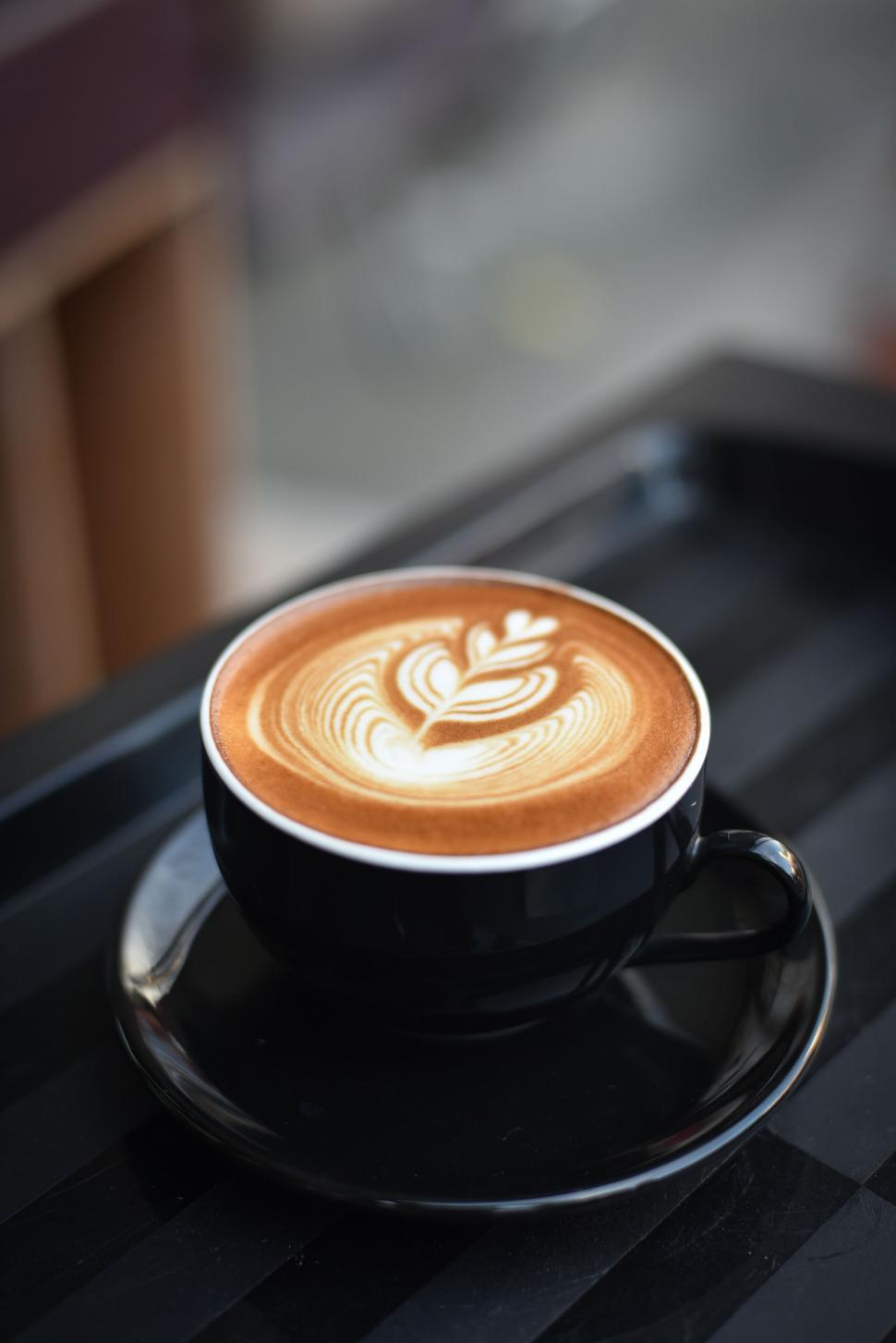 Free Image of Perfectly crafted latte art in black cup 