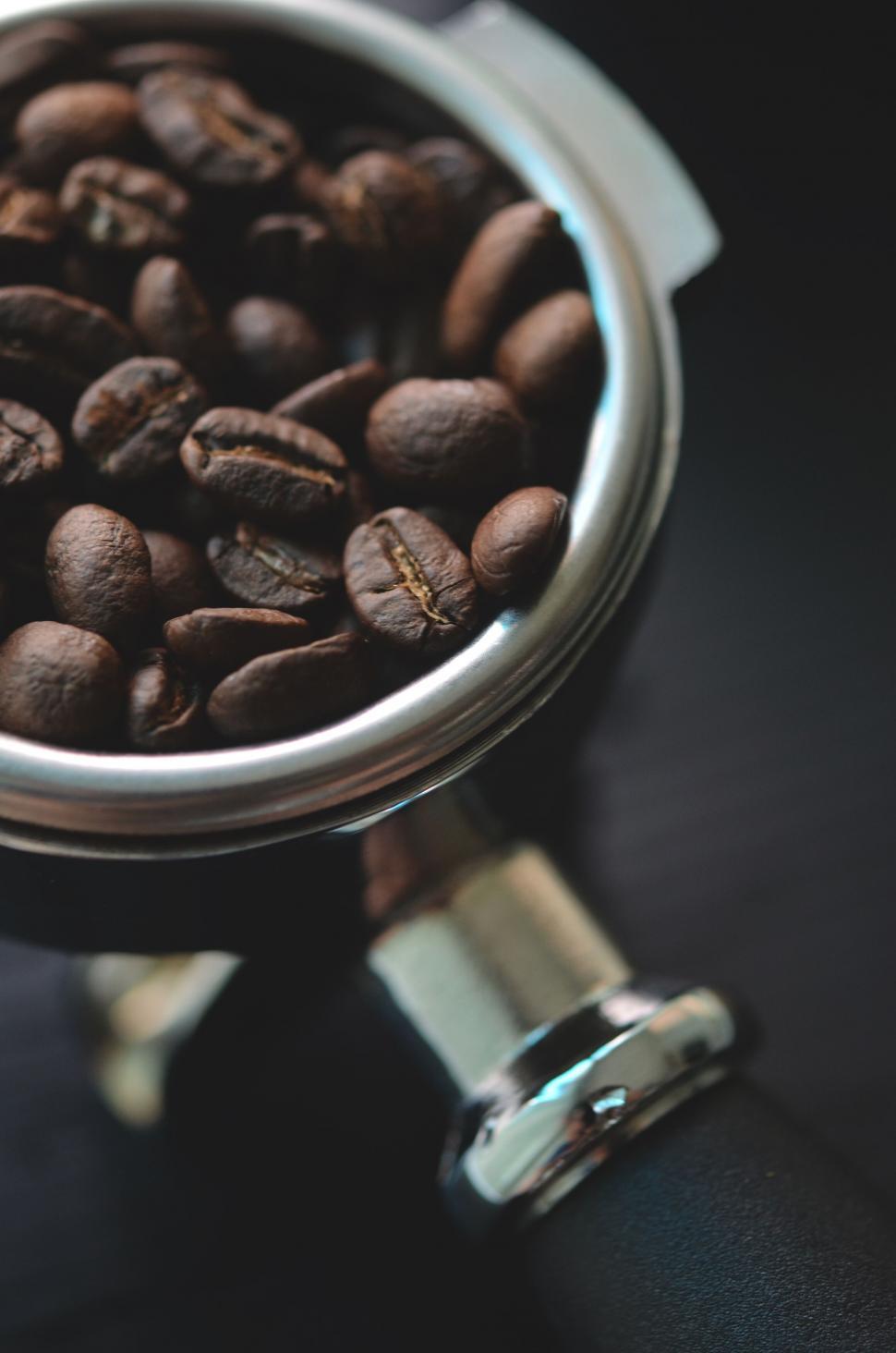 Free Image of Close-up of coffee beans in a portafilter 