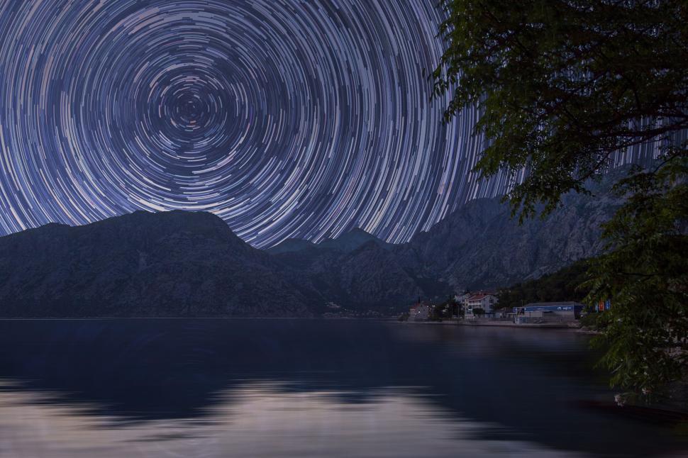 Free Image of Star trails over a mountain and lake 