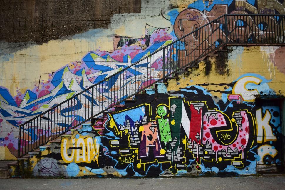 Free Image of Urban stairway adorned with vivid graffiti art 