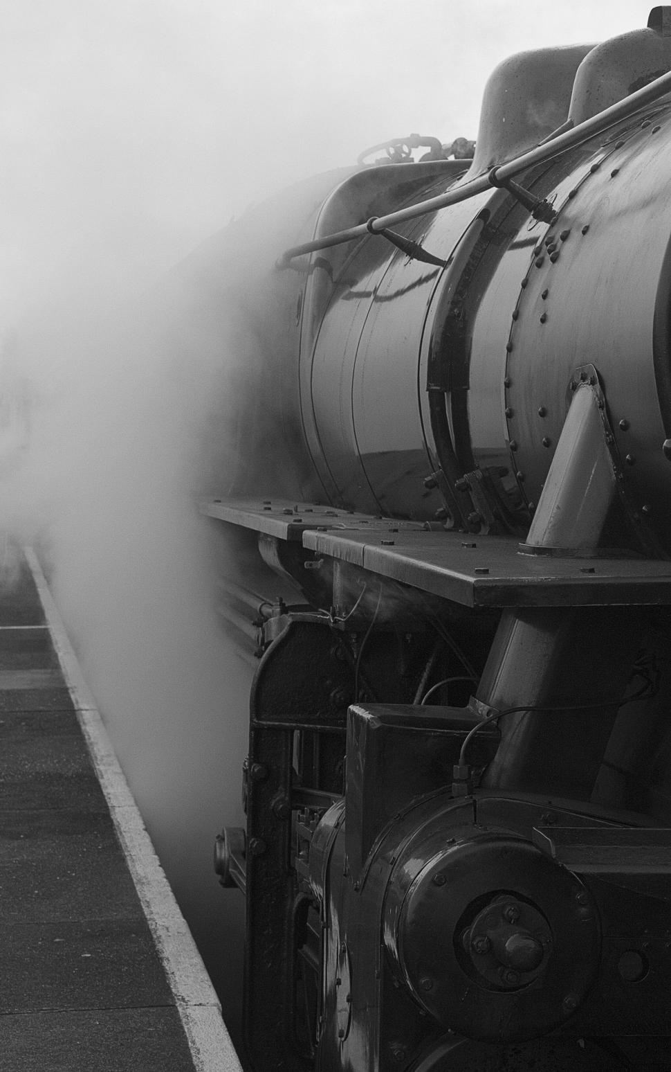 Free Image of Vintage steam locomotive exhaling steam on platform 