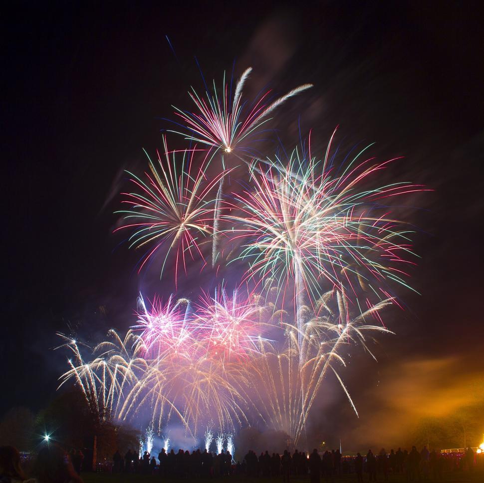 Free Image of Vivid firework display over a public field 
