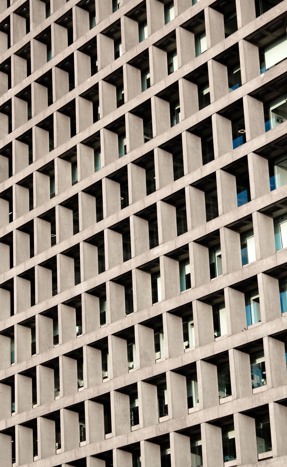 Free Image of Geometric pattern of building facade windows 