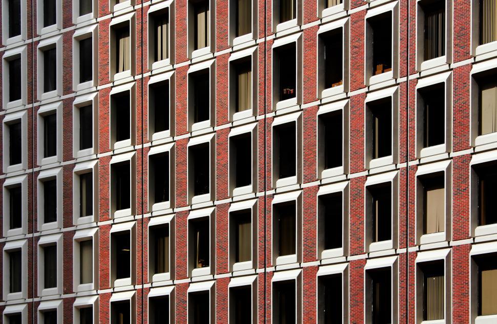 Free Image of Repeating patterns of windows on building facade 