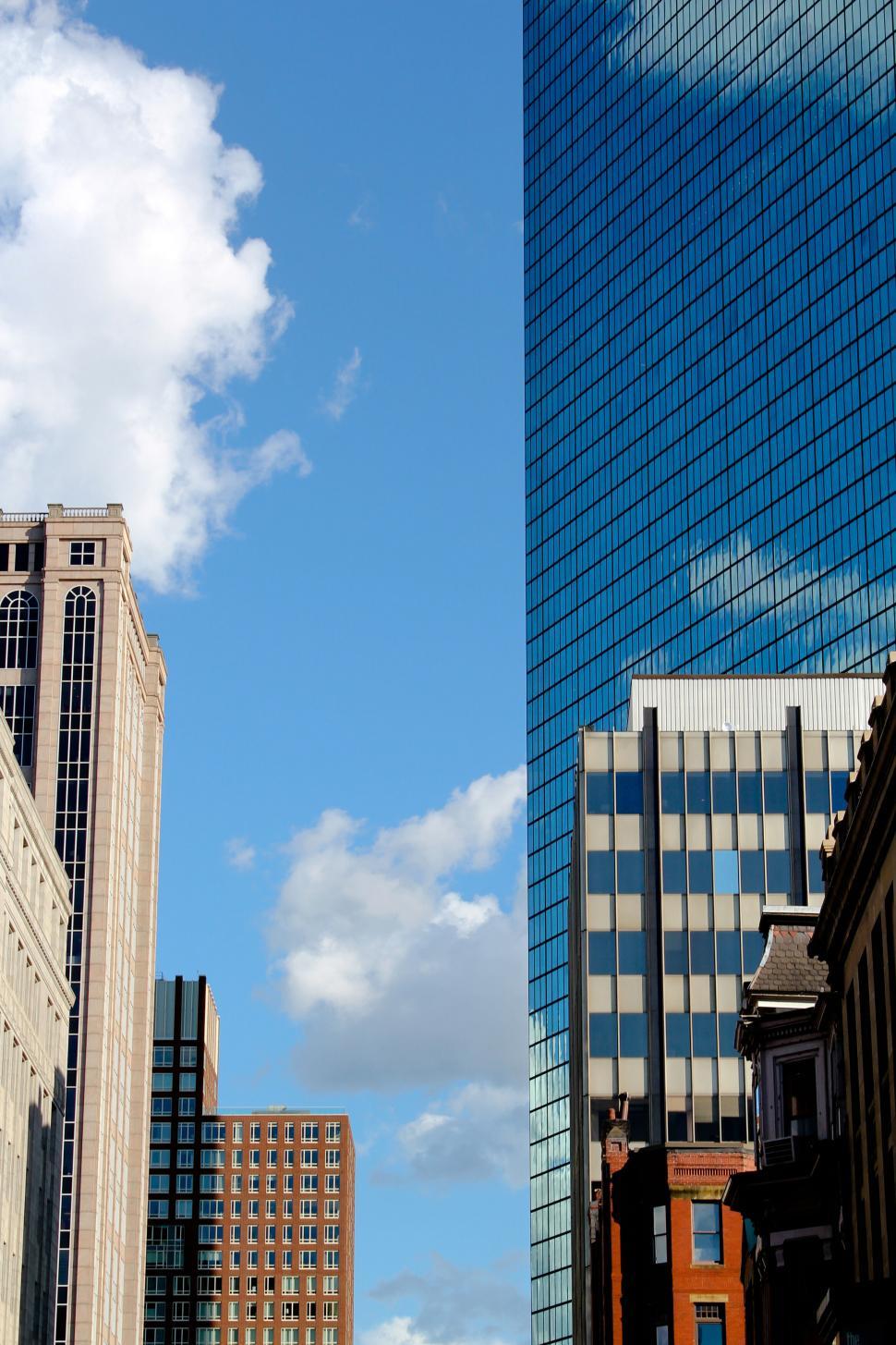 Free Image of Blue sky contrasted by urban highrise buildings 