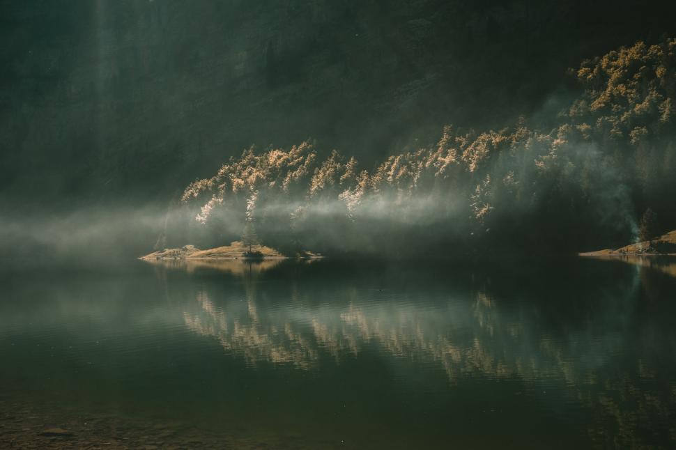 Free Image of Mystical lake with fog and sunbeam 